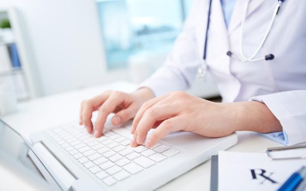 Modern medical person inputting diagnosis into an online data base