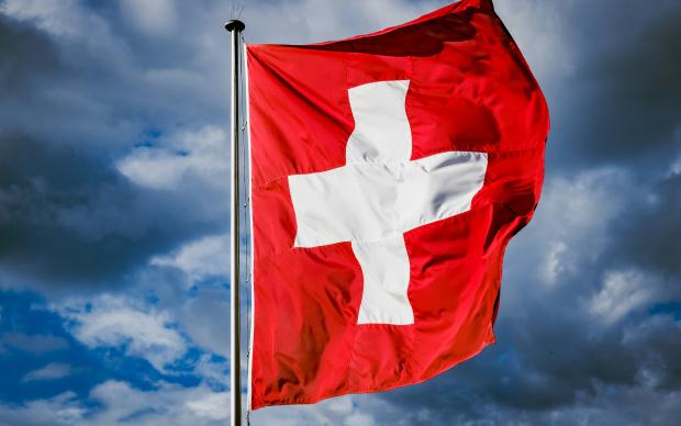 Swiss flag with sky background
