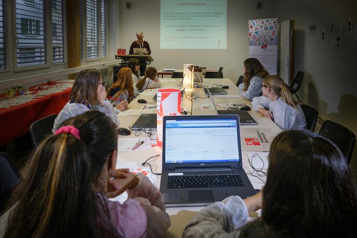 Classroom of young girls learing about bioinformatics