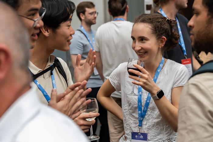 People discussing and drinking wine