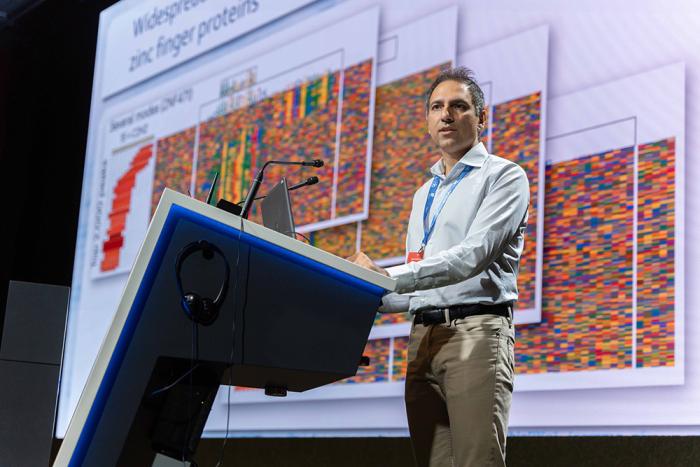 A speaker making a presentation at a conference