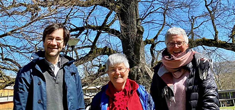 group picture of Christophe Dessimoz, Marie-Claude Blatter and Monique Zahn with tree in background 